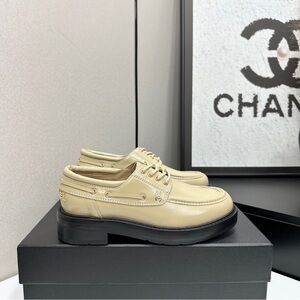 CHANEL Cream Leather Loafers